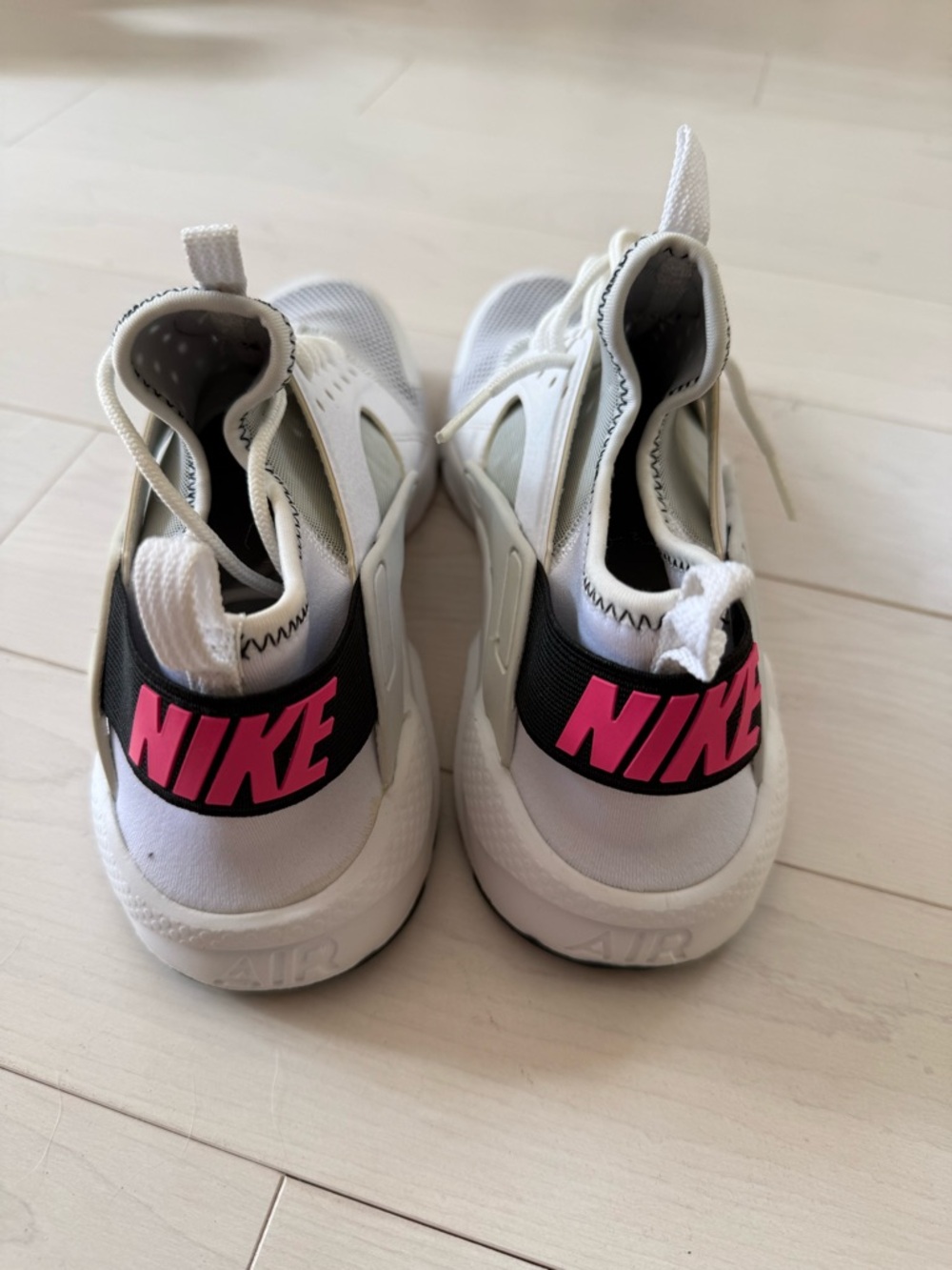 Nike White Sneakers with Pink Logo Accent